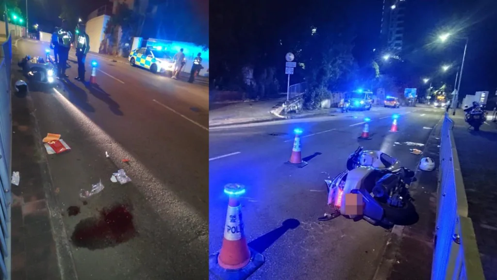 域多利道車禍現場，電單車倒臥路旁，路面留有雜物，警員在場調查。